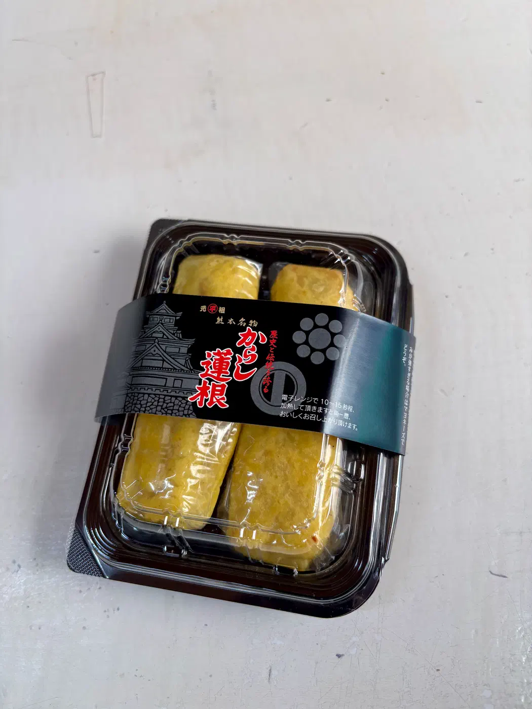 Trying Kumamoto’s local specialty, karashi renkon (mustard-stuffed lotus root).